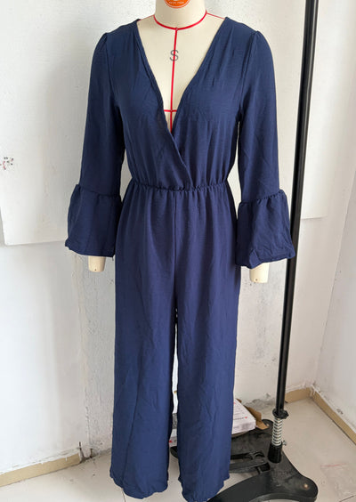 V-neck wide-leg jumpsuit in navy blue with gathered waist and flared bell sleeves