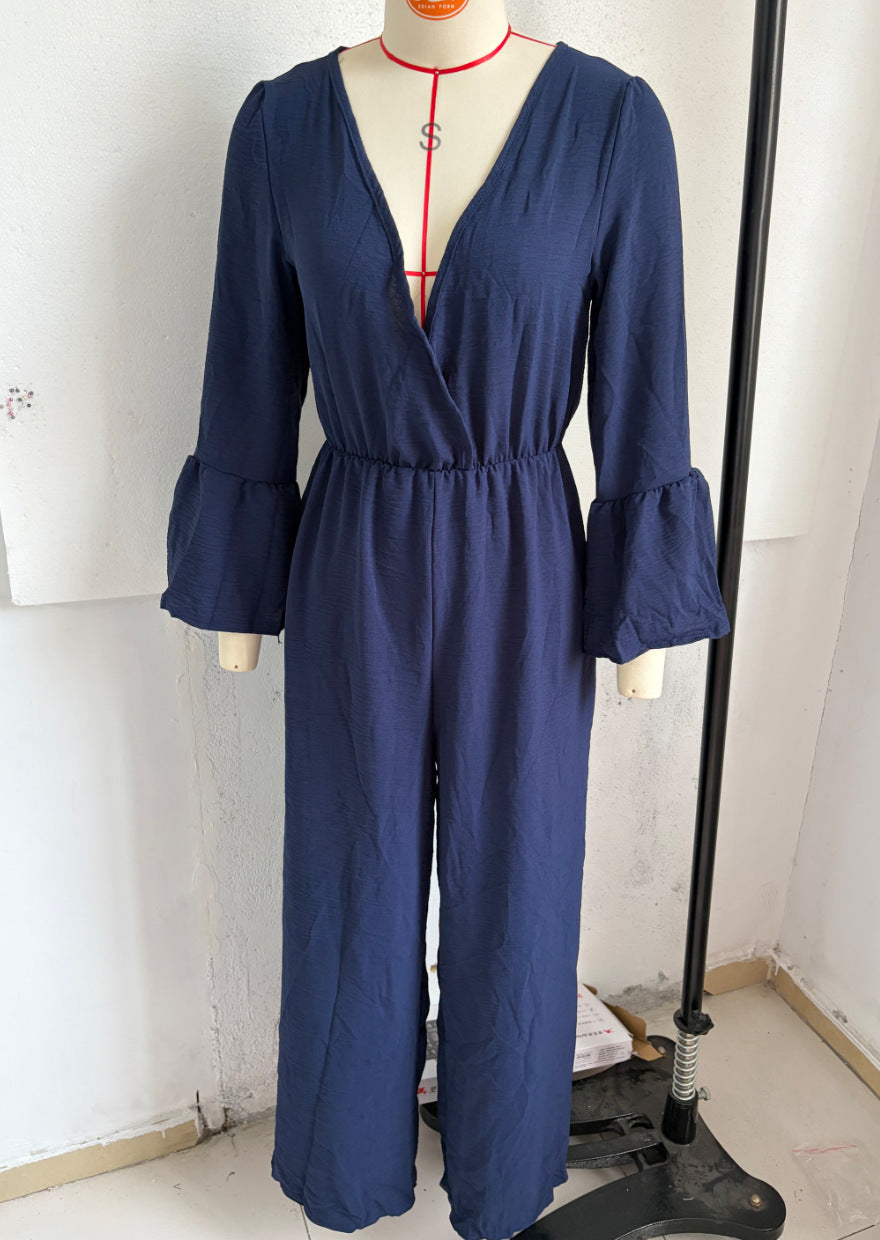 V-neck wide-leg jumpsuit in navy blue with gathered waist and flared bell sleeves