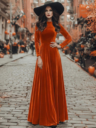 Orange velvet maxi dress with long sleeves and flared skirt