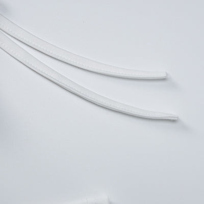 White neckline trim and seam detail on long-sleeve maxi dress fabric