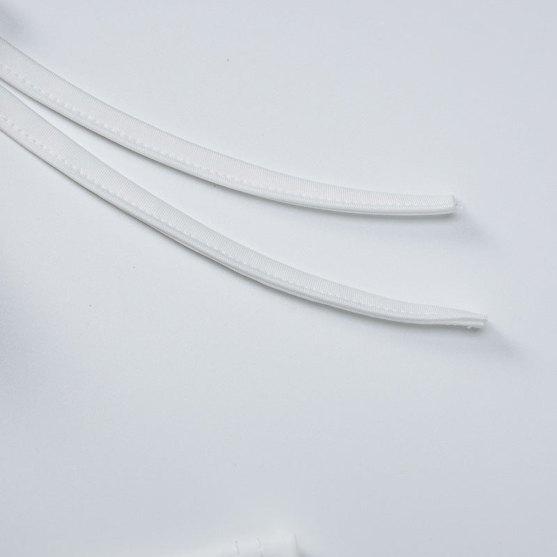 White neckline trim and seam detail on long-sleeve maxi dress fabric
