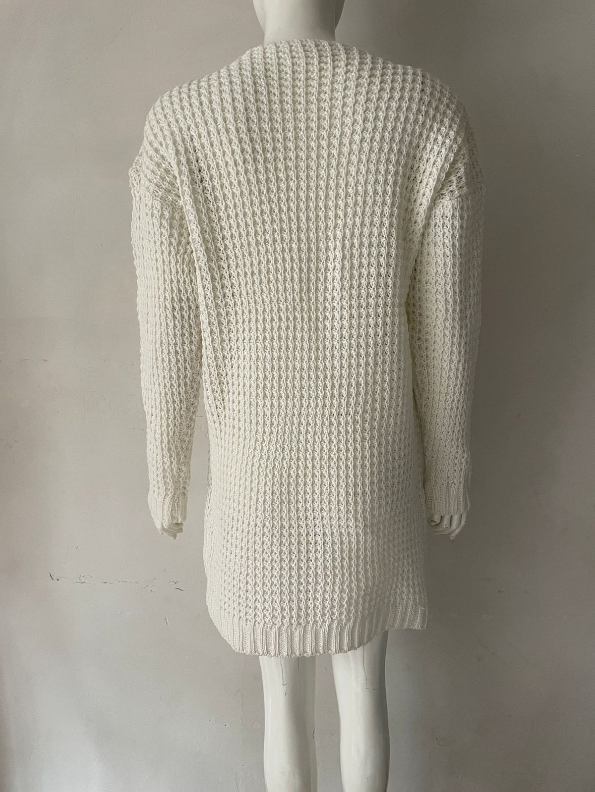 White knit sweater mini dress, back view with V-neck shaping and long sleeves