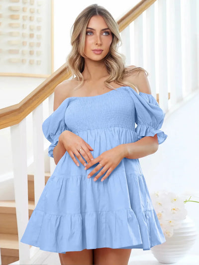 Light blue off-shoulder smocked mini dress with puff sleeves and tiered skirt