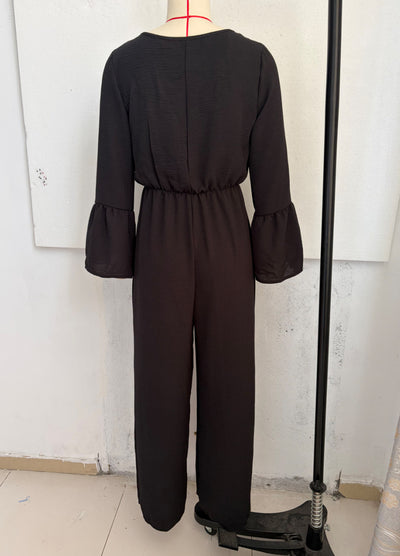 Black wide-leg jumpsuit with gathered waist and flared sleeves, back view