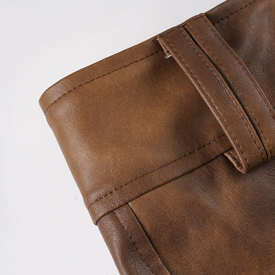 Waistband with stitched panel and belt loops on brown leather-look shorts.
