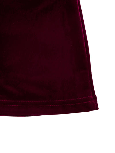 Close-up of burgundy velvet mini dress hem with visible stitch detail
