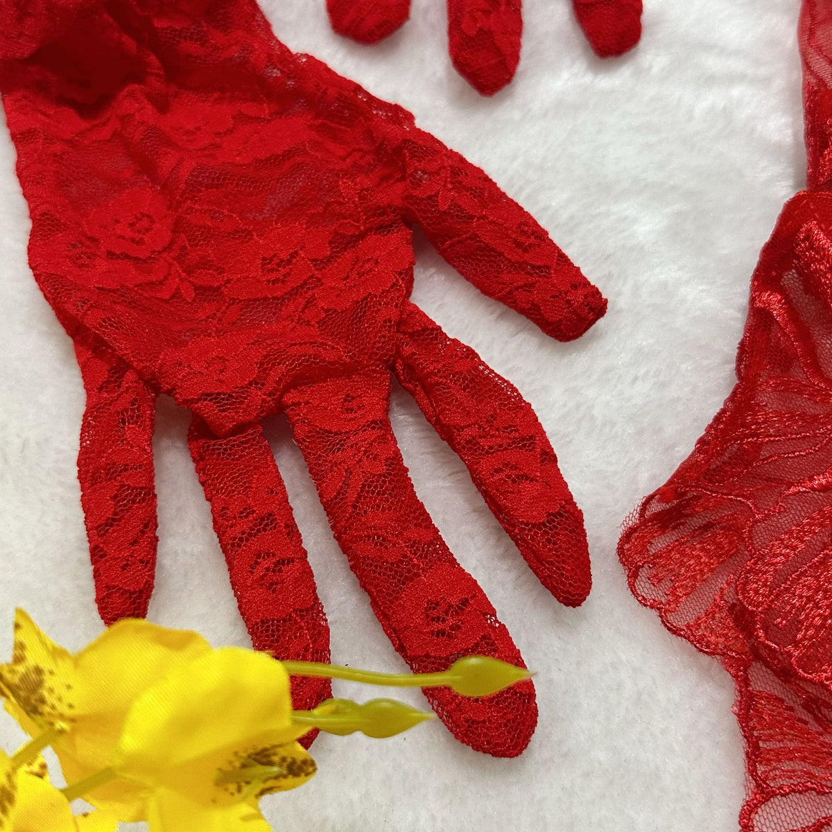 Red sheer lace gloves accessory with floral texture
