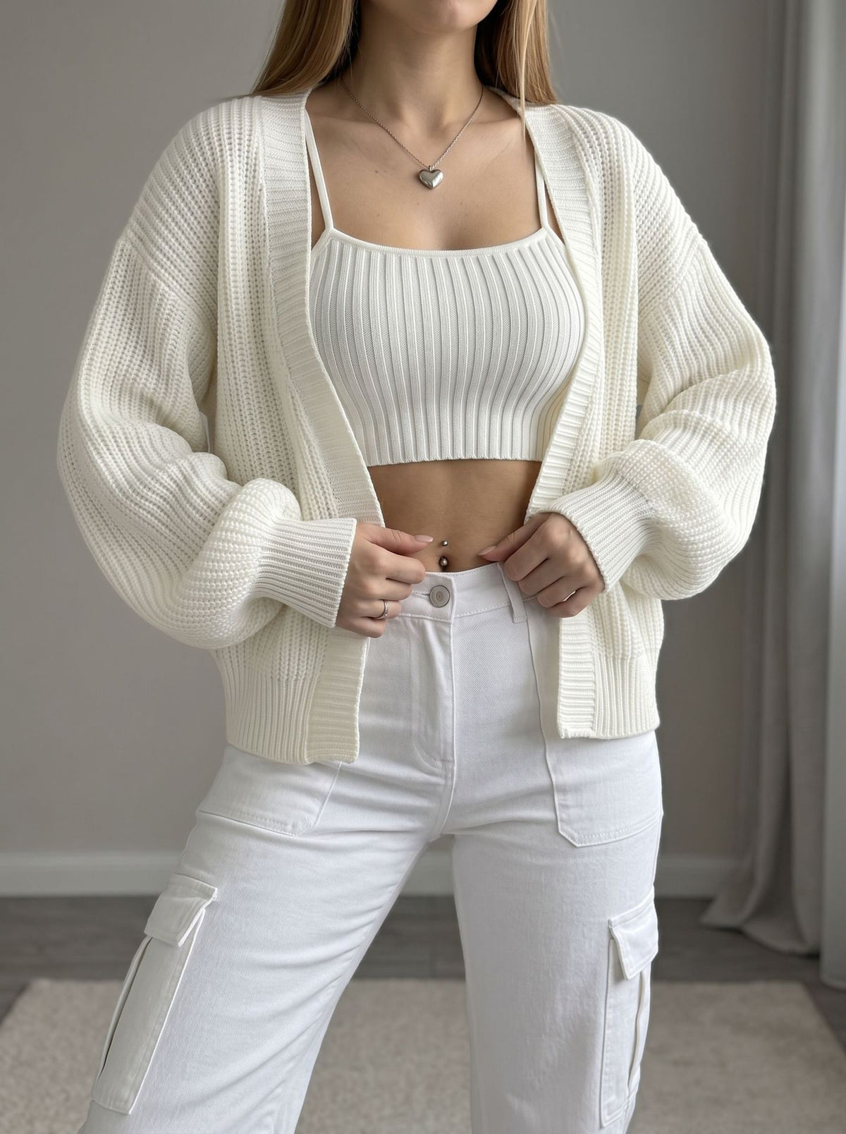 White open-front knit cardigan with balloon sleeves and ribbed cuffs
