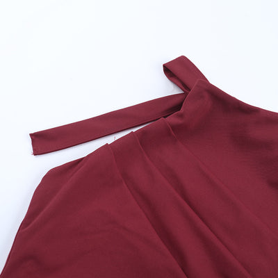 Close-up of wine halter neckline and gathered fabric on a slit maxi dress