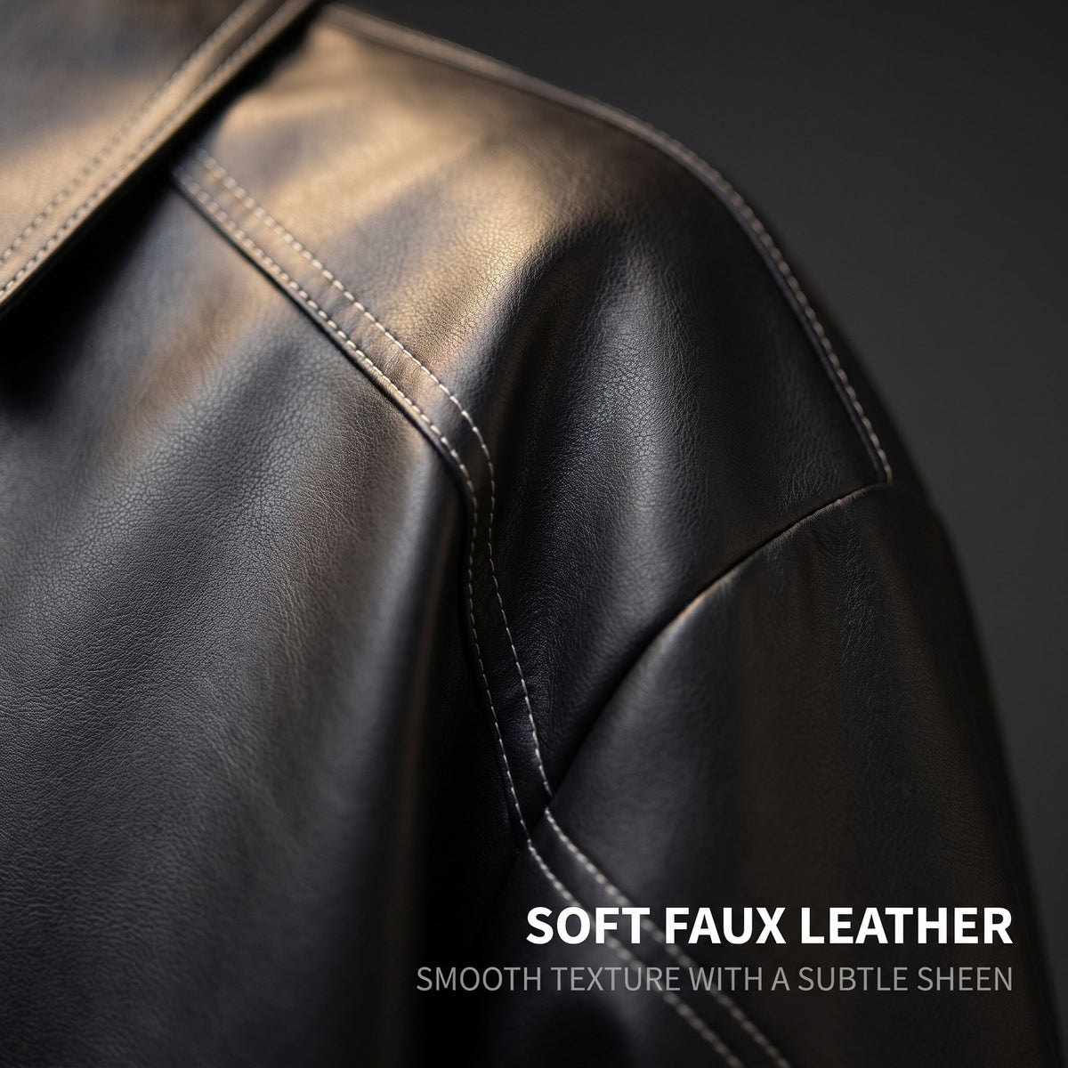 Black faux leather jacket close-up with smooth sheen and contrast seam stitching