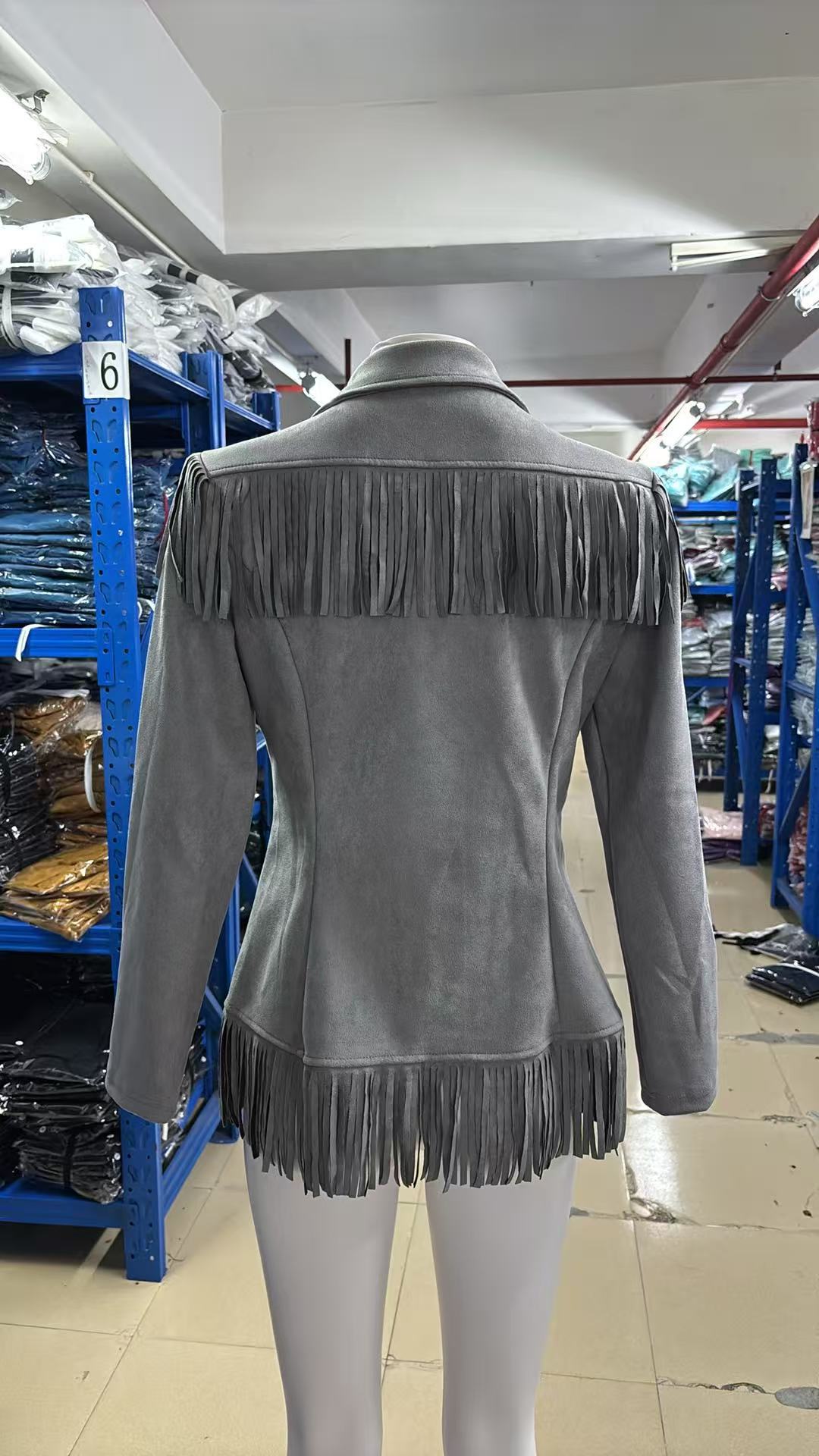 Gray fringe jacket with notched lapels and shaped seams, fringe yoke and hem