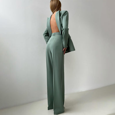 Three-piece suit set in muted green shown from the back: blazer, vest, wide-leg pants
