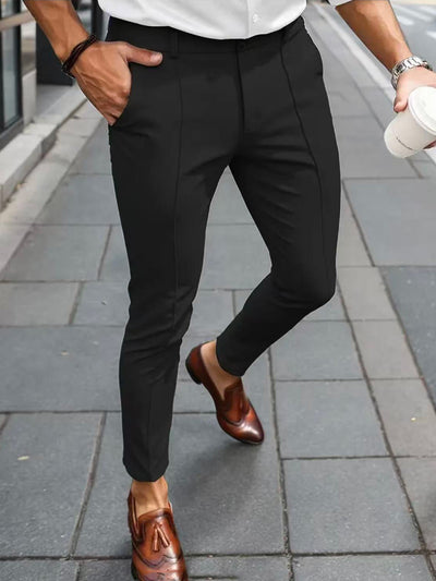 Men's slim-fit black dress pants with front seams and ankle-length tapered leg