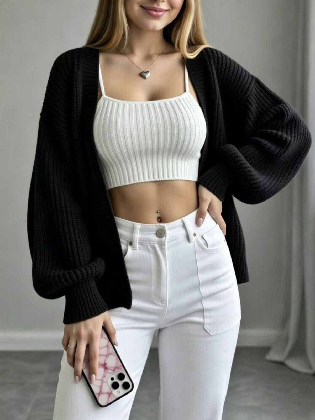 Black knit cardigan with open front, balloon sleeves, ribbed knit texture