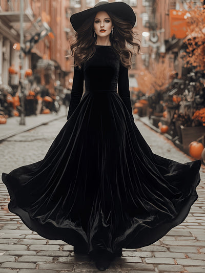 Black velvet maxi dress with long sleeves and flared skirt