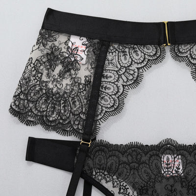 Black lace thong with scalloped lace panel and central buckle strap detail