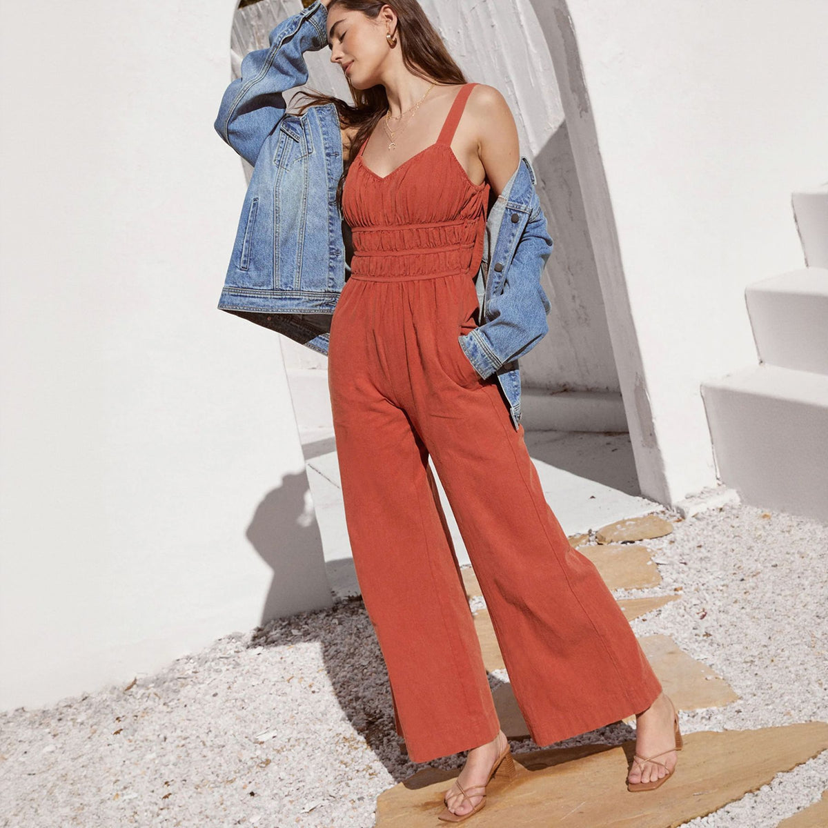 Redwood red sleeveless V-neck wide-leg summer jumpsuit with smocked bodice and side pockets