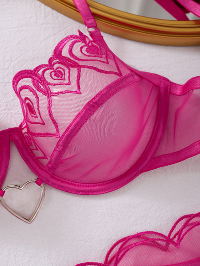 Close-up rose red sheer mesh bra with heart embroidery and small heart charm