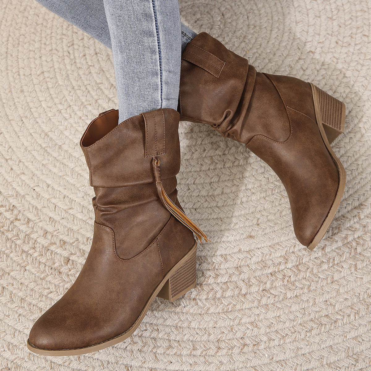 Dark brown slouchy western boots with block heels and side pull tabs