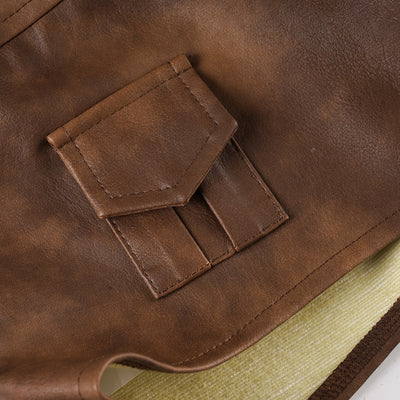 Back patch pocket detail with stitching on brown leather-look shorts.