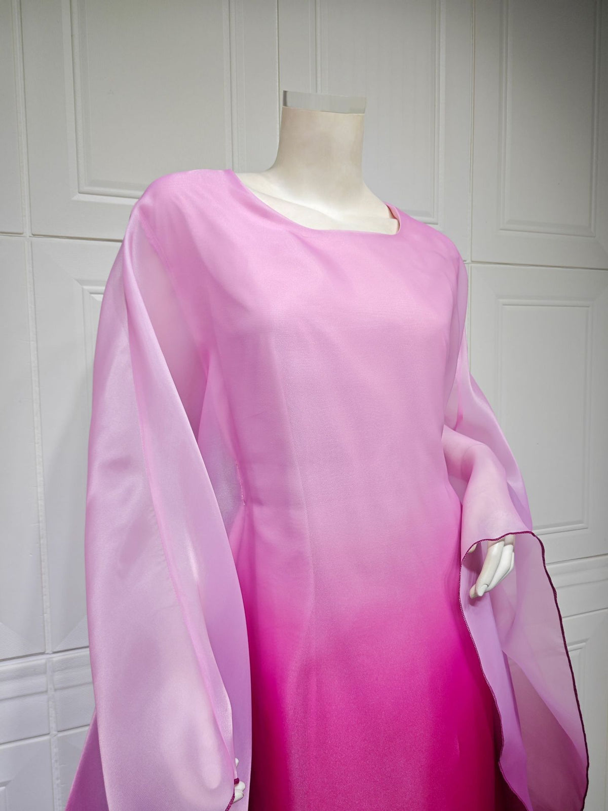 Ombre satin maxi dress in pink-to-purple with sheer batwing sleeves and rounded neckline.