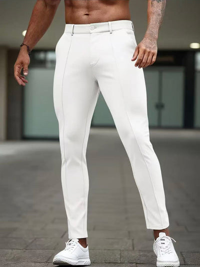 Men's slim-fit white dress pants with front seams and ankle-length tapered leg