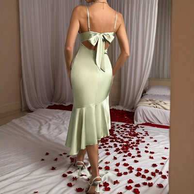 Light green satin midi dress, open back with tied bow and fluted mermaid hem