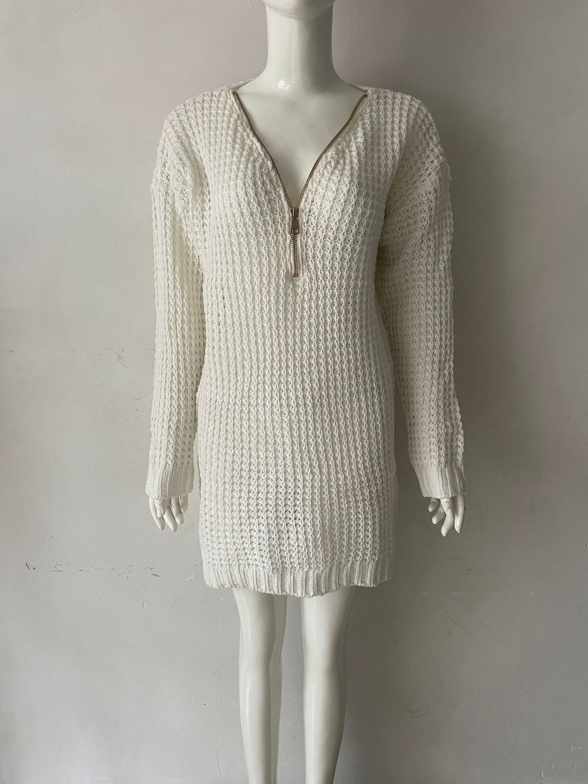 White knit V-neck mini sweater dress with half-zip front and ribbed sleeve cuffs