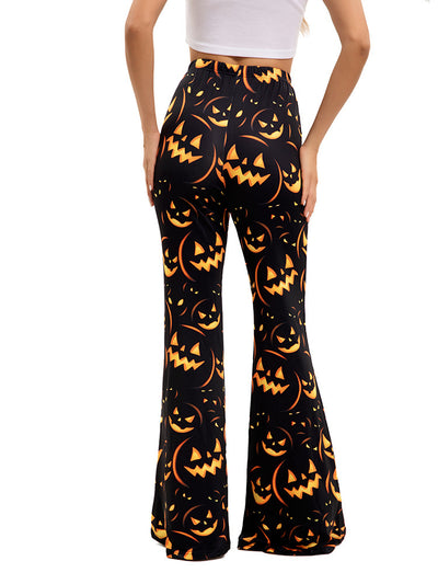 Women’s flared Halloween pants, black with orange jack-o’-lantern faces and pumpkins