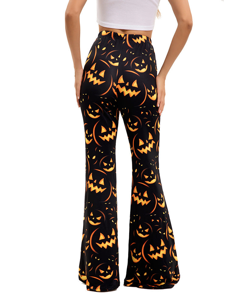 Women’s flared Halloween pants, black with orange jack-o’-lantern faces and pumpkins