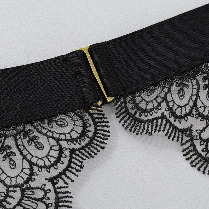 Black waistband band with gold-tone buckle and lace-trim edge