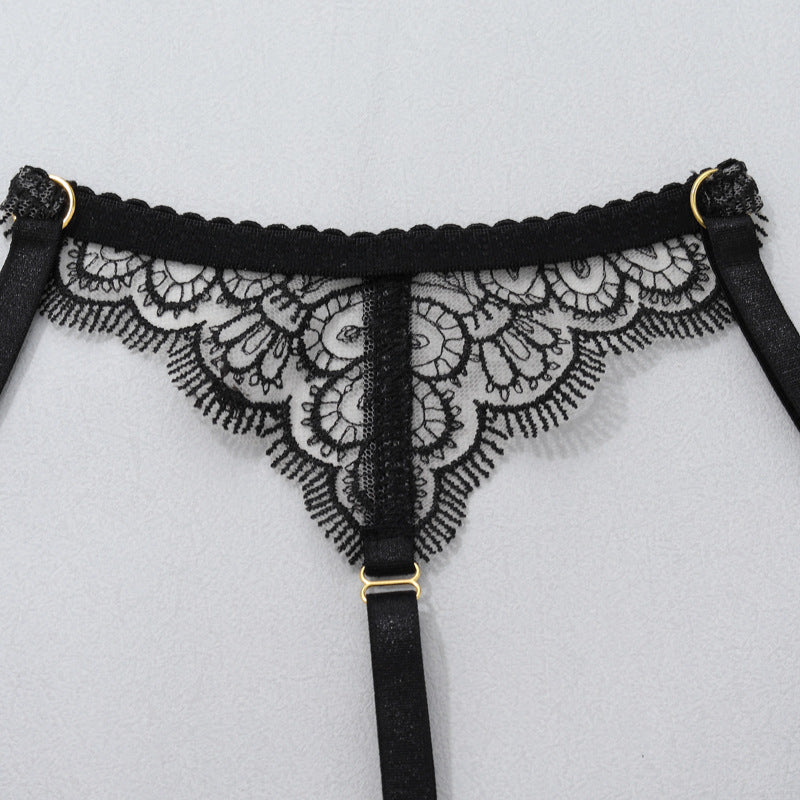 Black lace garter thong with central vertical strap and adjustable buckle