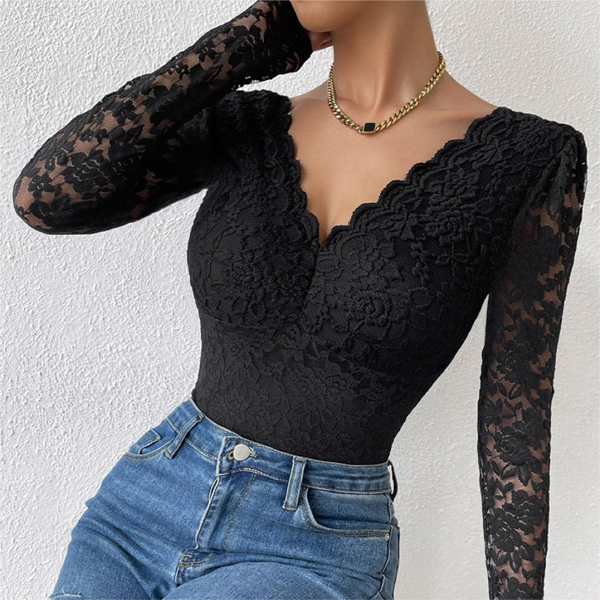 Black lace long-sleeve bodysuit with scalloped V-neck and sheer lace sleeves