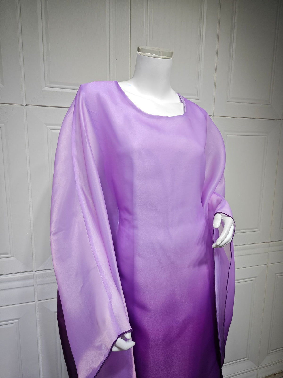Ombre satin maxi dress with sheer draped batwing sleeves in lavender-purple.