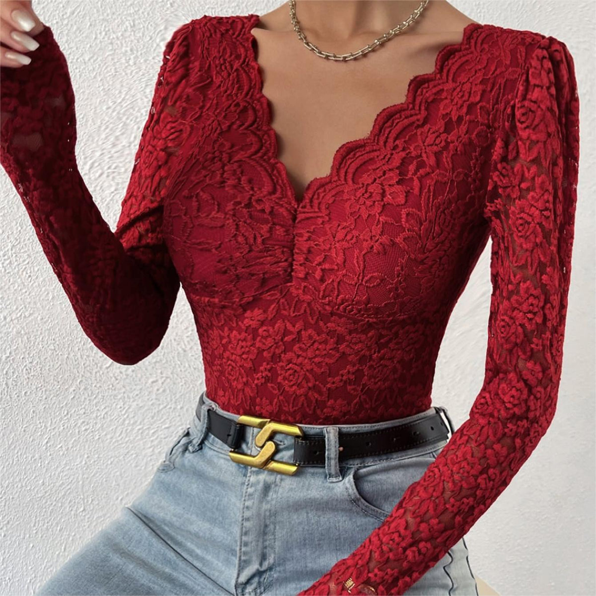 Wine red lace long-sleeve bodysuit with scalloped neckline and textured fabric