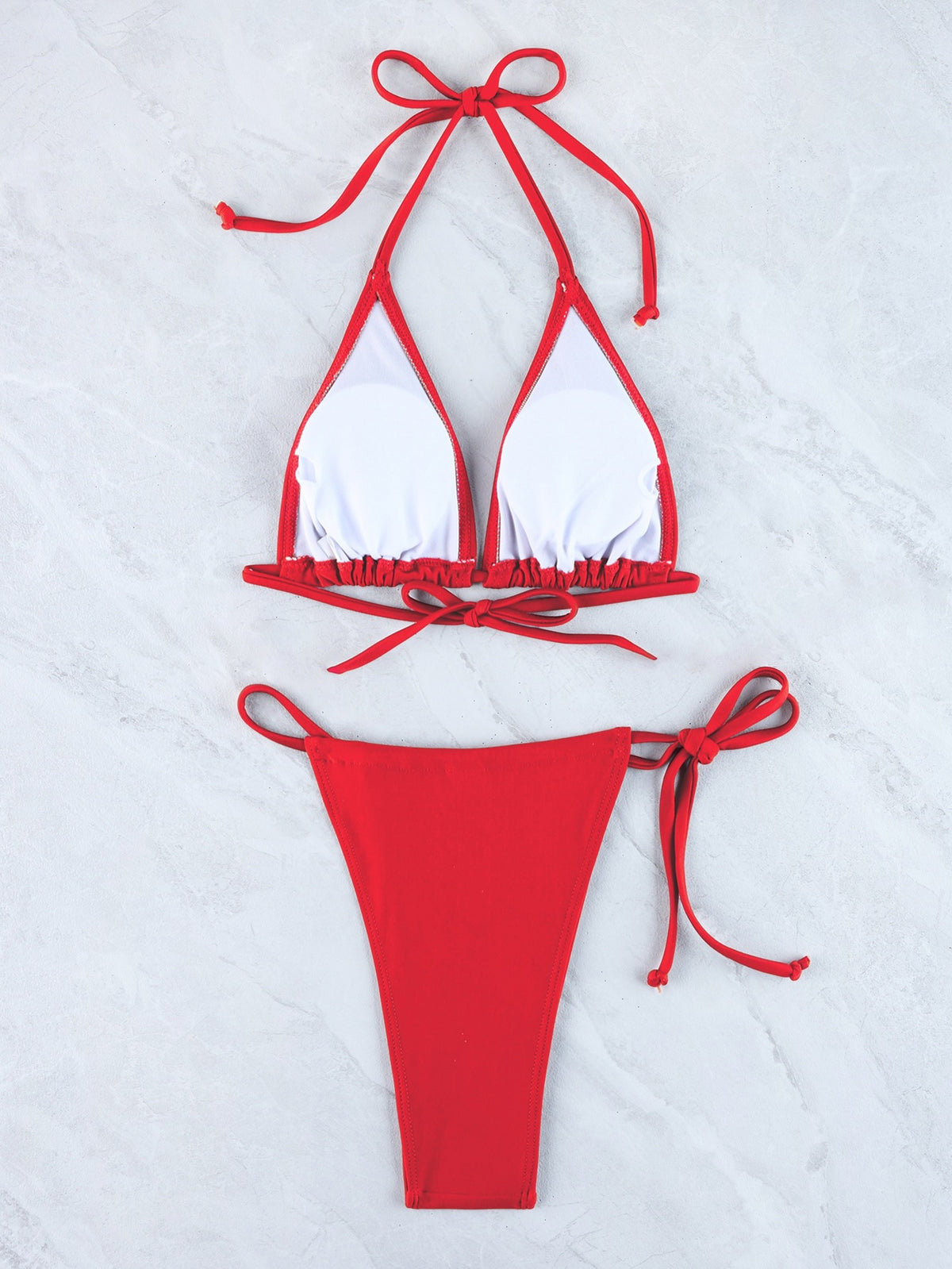 Halter triangle bikini set with red triangle top, red string bottoms, and neck ties