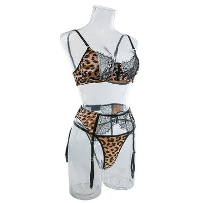 Leopard-print lace bra with garter belt and thong on mannequin, black scalloped lace