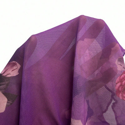 Light purple floral blouse fabric close-up with layered ruffle texture