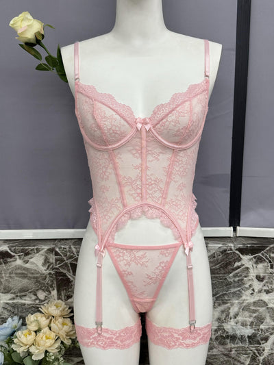 Pink lace bustier set with scalloped cups, underbust lace, and garter straps on mannequin
