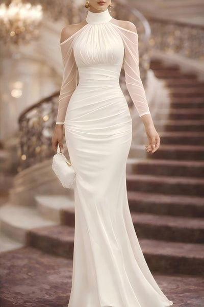 White sheer long-sleeve evening gown with high halter neck, ruched bodice and long skirt