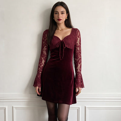 Burgundy velvet mini dress with lace sleeves and tied neckline bow