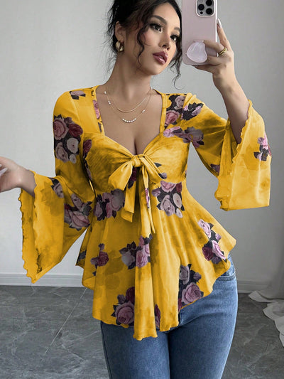 Floral bow-front blouse in yellow with long bell sleeves and flared hem