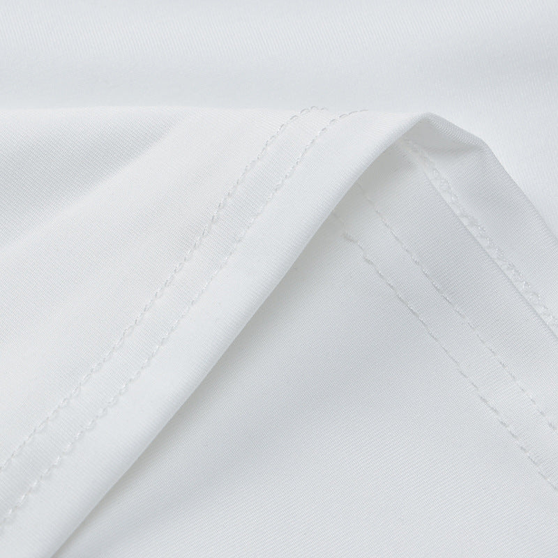 White maxi dress hem and seam close-up with visible stitching