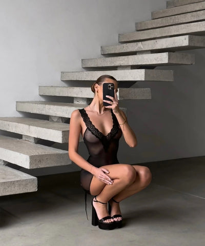 Black lace-trim mesh chemise on model, scalloped neckline and lace-up back