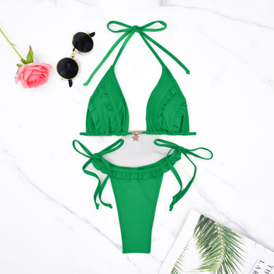 Green triangle bikini set with ruffled trim and tie closures, flat lay