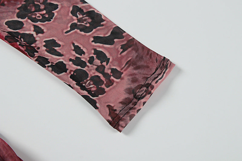 Close-up of mixed print mesh fabric corner in dark rose, black, and burgundy