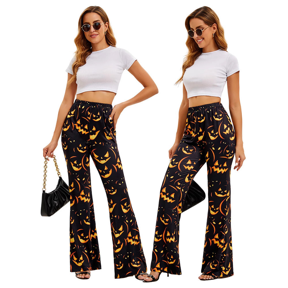 Women’s wide-leg Halloween pants, black with orange jack-o’-lantern allover print