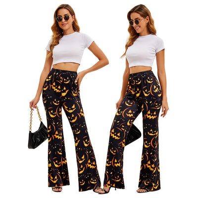 Women’s wide-leg Halloween pants, black with orange jack-o’-lantern allover print