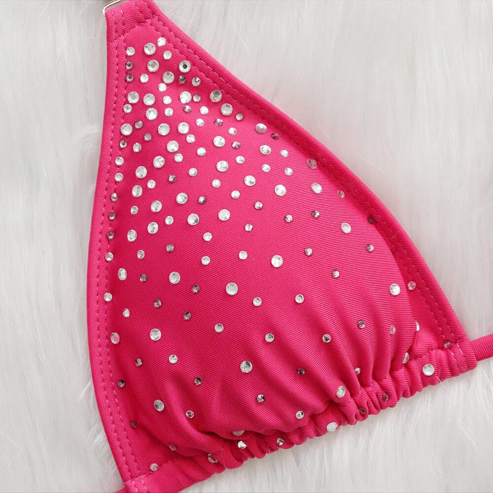 Hot pink triangle bikini top with dense rhinestone dots and ruched bottom