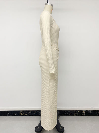 Cream knit maxi dress on mannequin, side view with long sleeve and gathered hip
